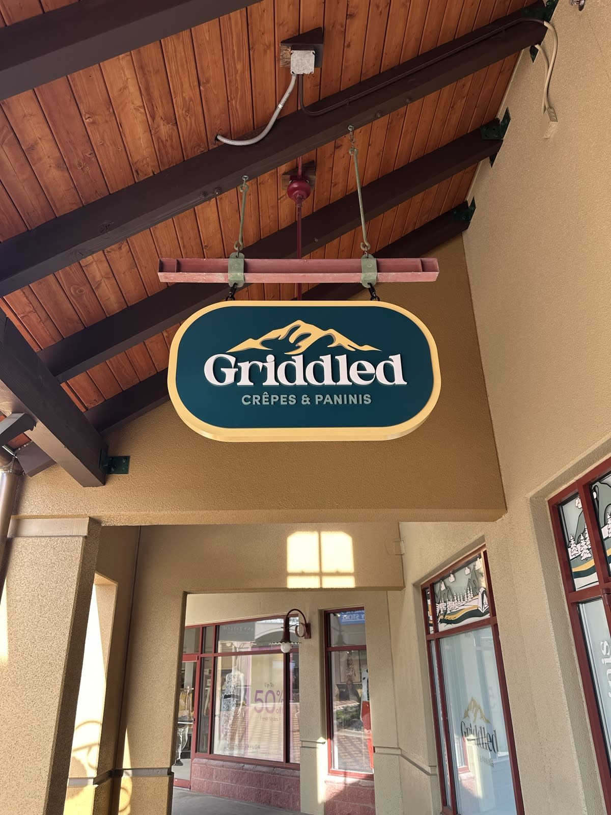 Griddled Crêpes & Paninis storefront sign at Outlets at Castle Rock, Suite 175
