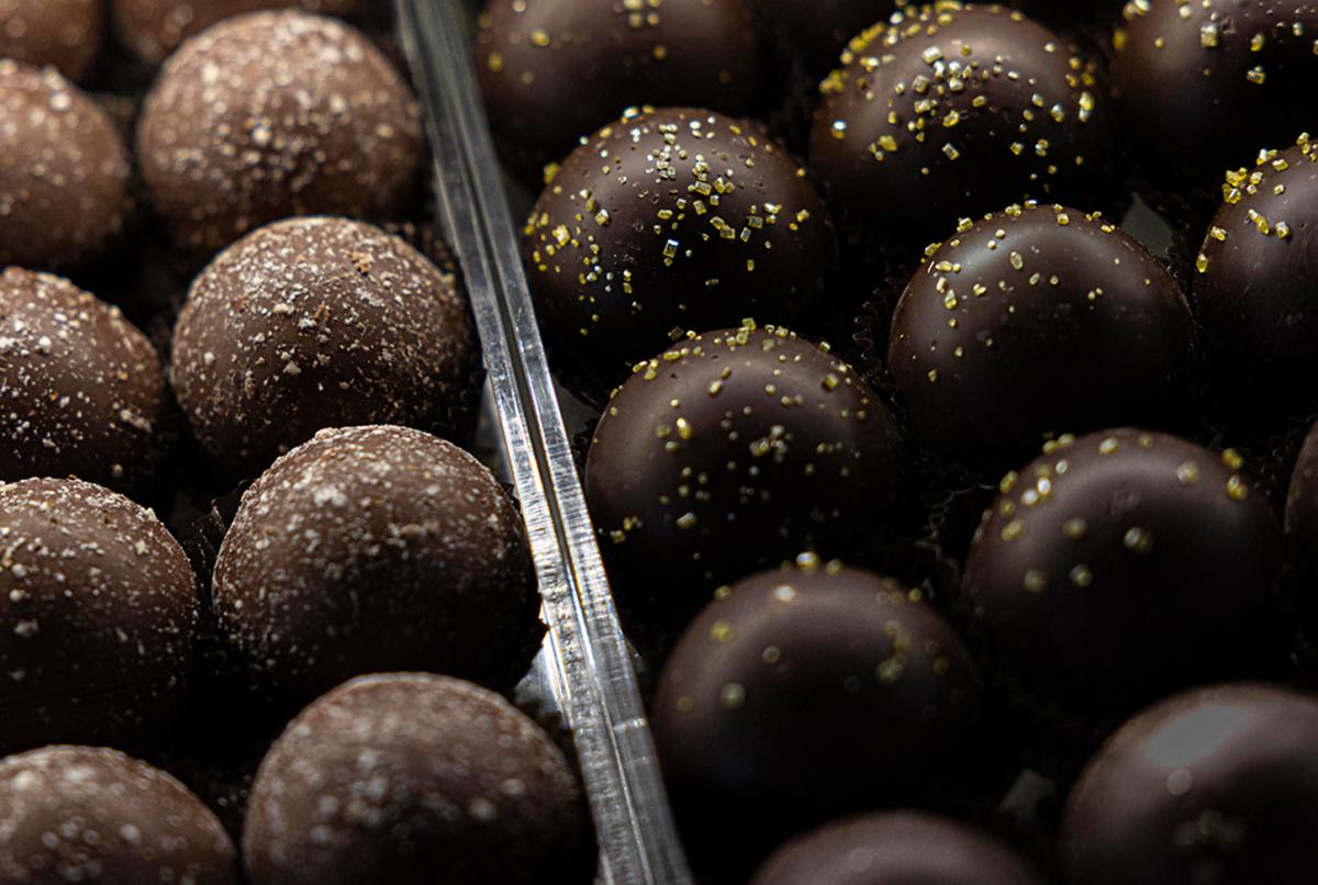 Rocky Mountain Chocolate Factory Café candy case at Outlets at Castle Rock — handcrafted truffles, caramel apples, and chocolate displays
