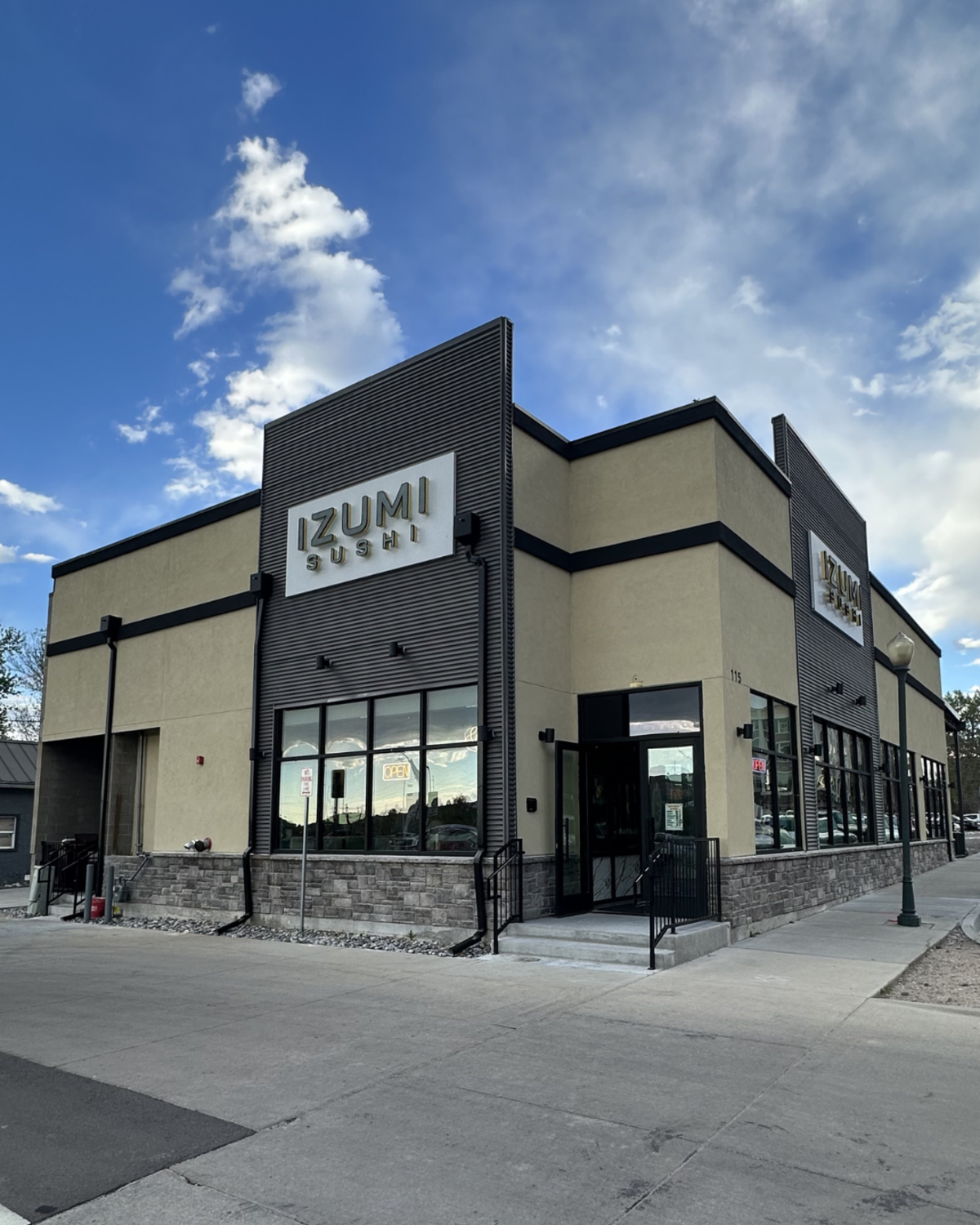 Izumi Sushi storefront with prominent signage on Third Street in downtown Castle Rock, Colorado.