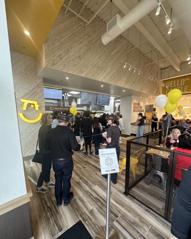 Customers ordering at Starbird Chicken counter
