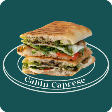 Cabin Caprese panini at Griddled — mozzarella, Roma tomatoes, arugula, pesto, balsamic glaze