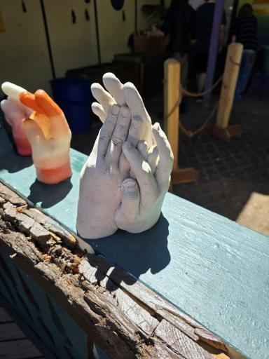 Designs In Wax (Wax Hands) atmosphere and seating