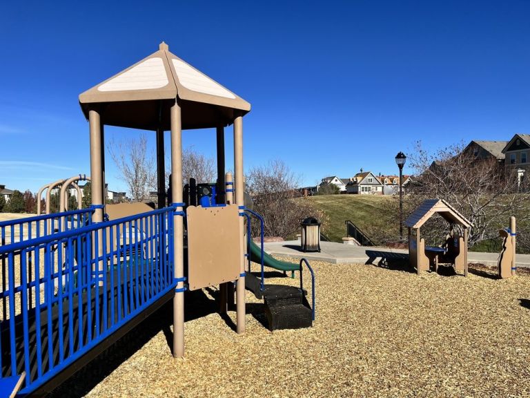 Belvedere Park play structure surrounded by shade trees
