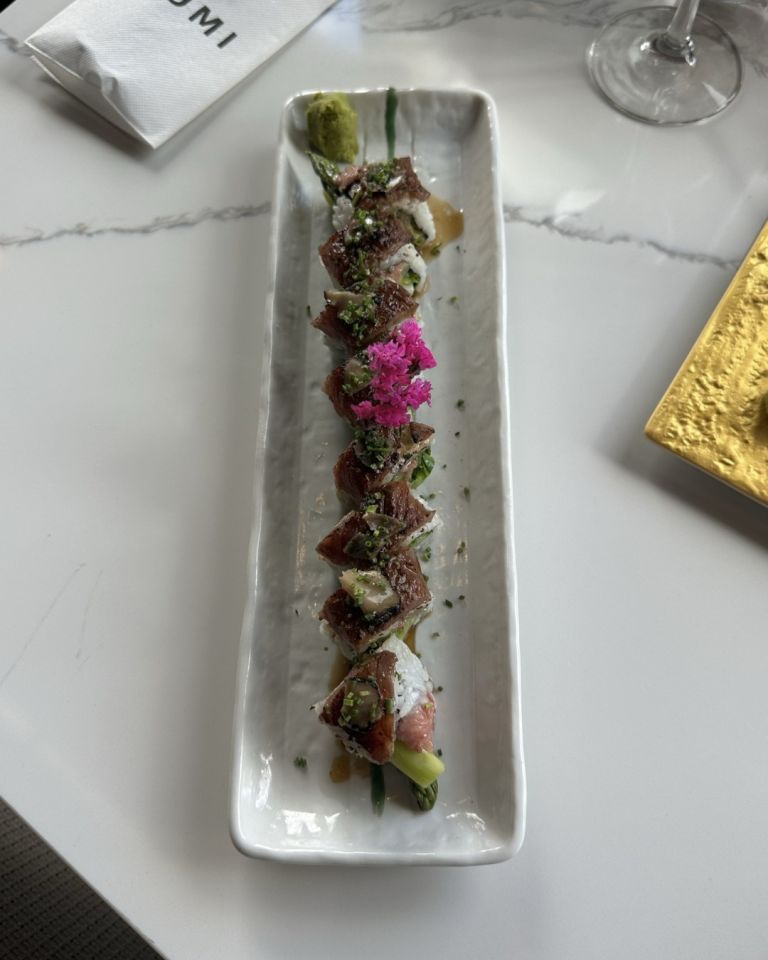 Kobe Beef Truffle Roll on long white plate at Izumi Sushi