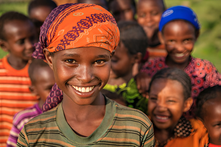 Smiling woman with orange headwrap