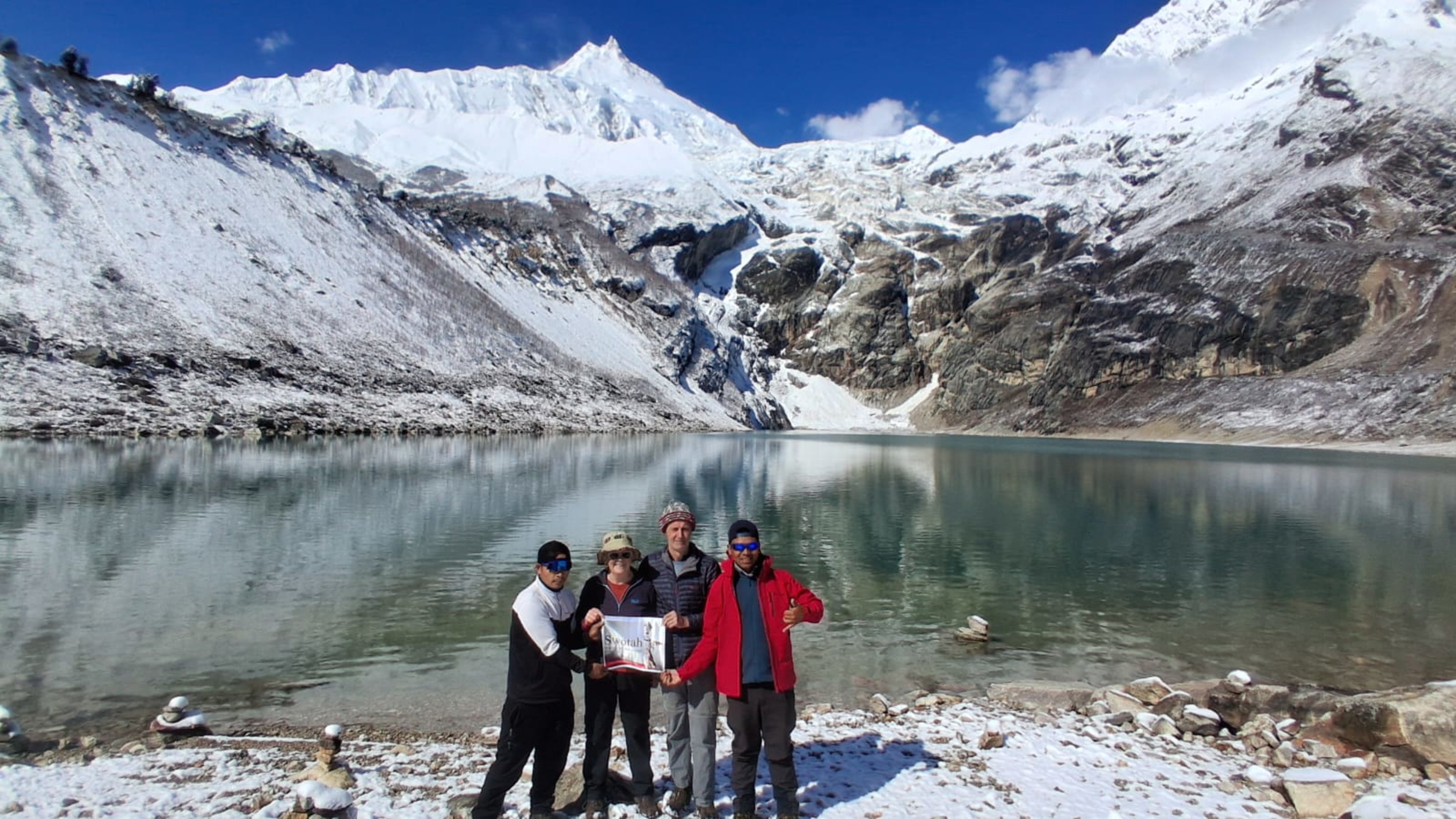 Trekkers gather beside Birendra Lake