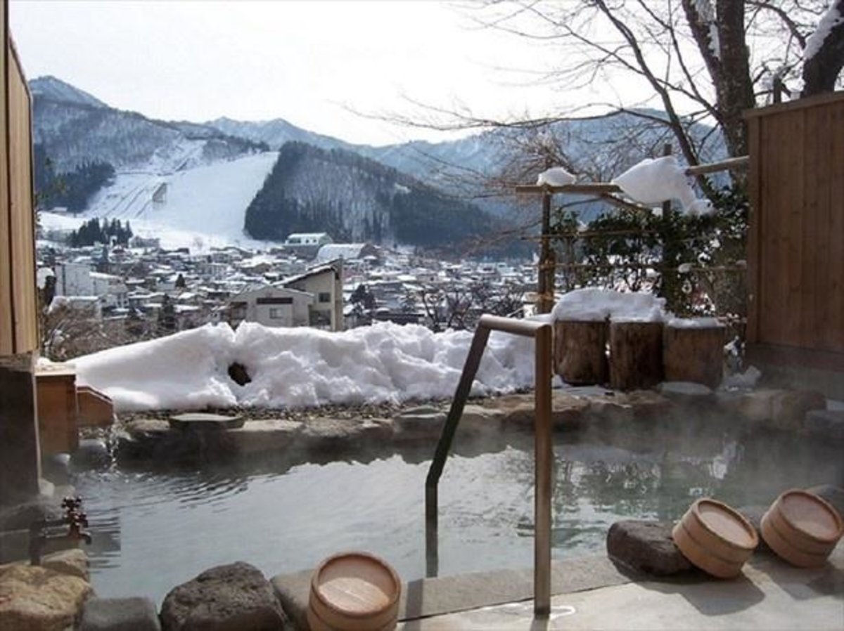 Japanese onsen surrounded by snow in winter
