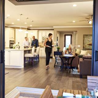 Del Webb Naples January 2016 Shoot, Hi-Res for Print, Del Webb-DinnerParty_1553.jpgcouples having dinner open floor plan Expires 05-2-22