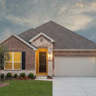 The Dayton, a one-story home with 2-car garage, shown with Home Exterior B