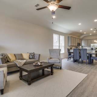 Open floorplan showcasing kitchen, spacious gathering room and dining areas