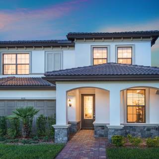 The Fifth Avenue, a two-story family home with a 2 car garage, shown as the model at The Fields