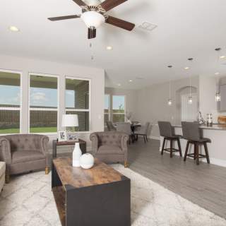 Open floorplan showcasing kitchen, spacious gathering room and dining areas