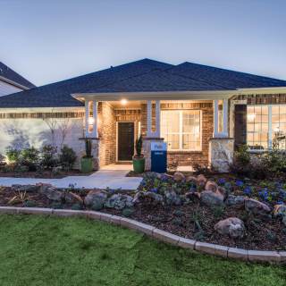 The Dunlay, a one-story home with 2-Car Garage, shown with Home Exterior D  