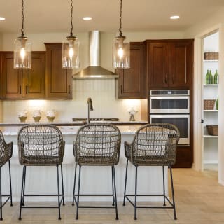 The Kitchen is Complete with an Oversized Pantry and Plenty of Overhead Lighting