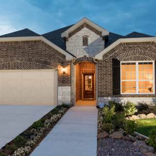 Exterior C with stone accents, black shutters, and 2-car garage with storage space
