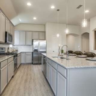 Spacious eat-in kitchen offers a large island and abundant cabinet space