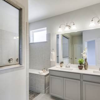 Owner's bathroom offers an optional walk-in glamour shower
