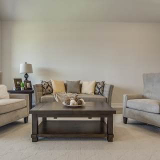 The gathering room features abundant natural light and optional fireplace