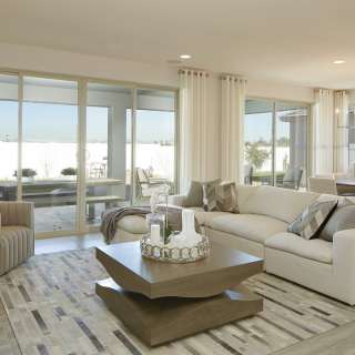 The gathering room includes bright windows and a g