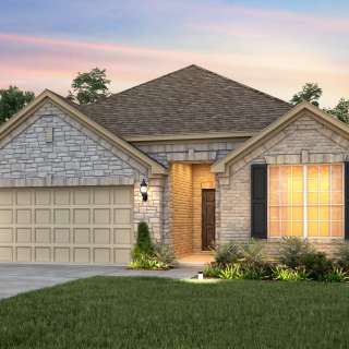 Exterior D of the Mckinney, a one-story home with shutters and stone