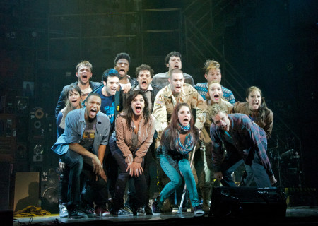 The company of "American Idiot." The national tour of the smash hit, rock opera will be presented in Los Angeles at the Ahmanson Theatre March 13 – April 22, 2012. Opening is set for March 14. "American Idiot" features the music of Green Day and the lyrics of its lead singer Billie Joe Armstrong, book by Armstrong and Michael Mayer, and direction by Mayer. Choreography is by Steven Hoggett, and music supervision, arrangements, and orchestrations are by Tom Kitt.