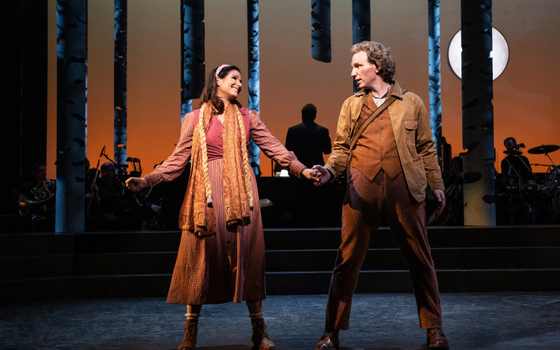 The Baker's Wife join hands with Baker while standing center stage in the woods