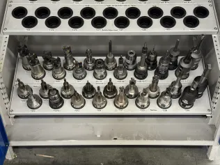 34 pcs. HSK-A63 tool holders with tools