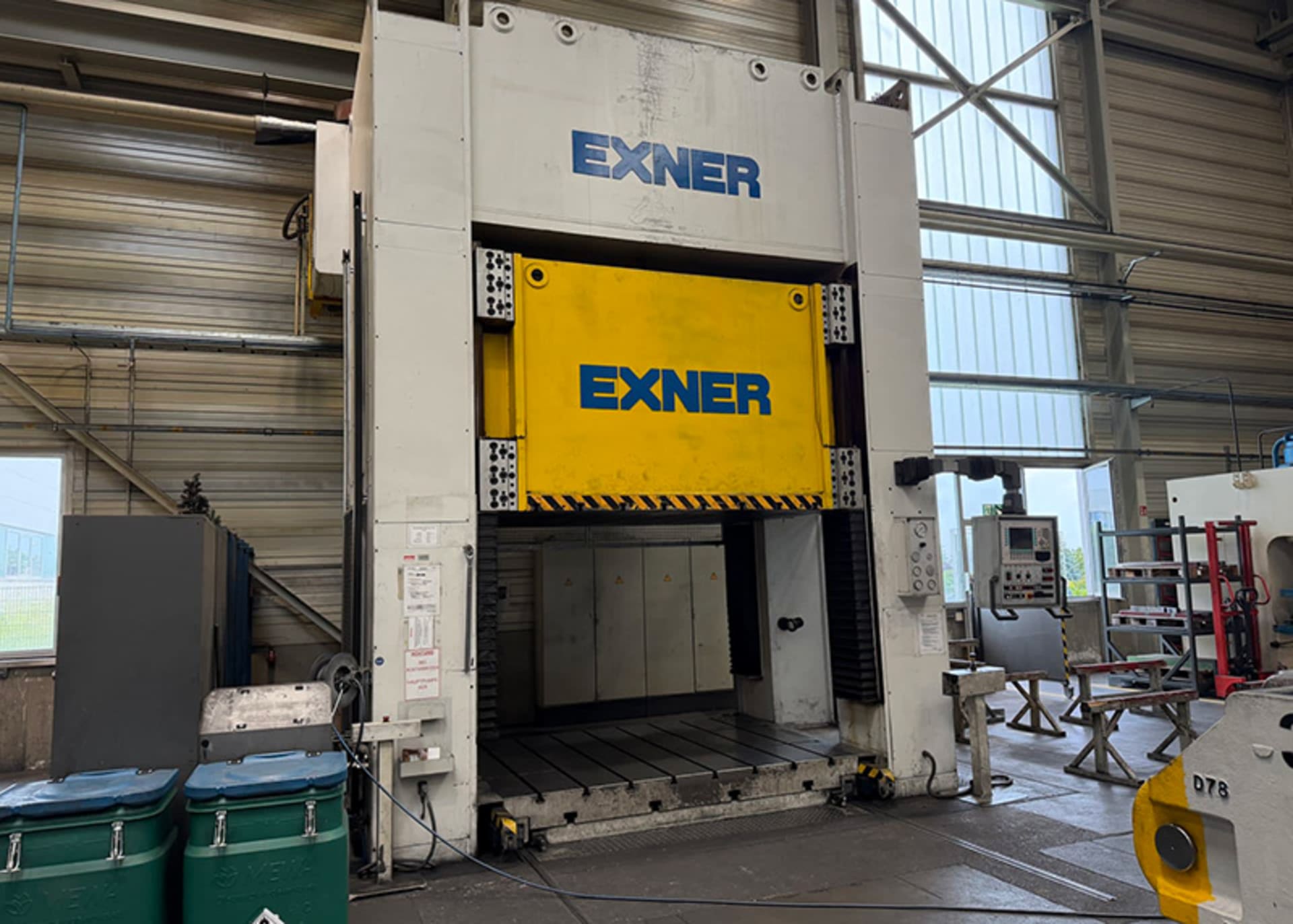EXNER EXSBRD 500ET hydraulic press with a yellow ram, T-slot table and control panel on the right