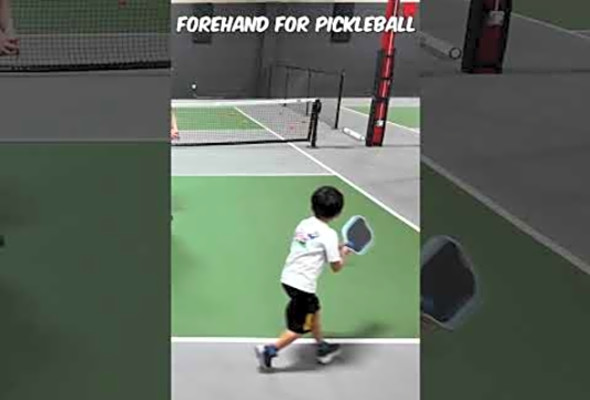 6 year old kid practicing massive forehand for pickleball
