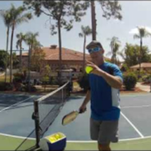Coach David Wyrsch instructing Brenda on how to do the crosscourt dink s...