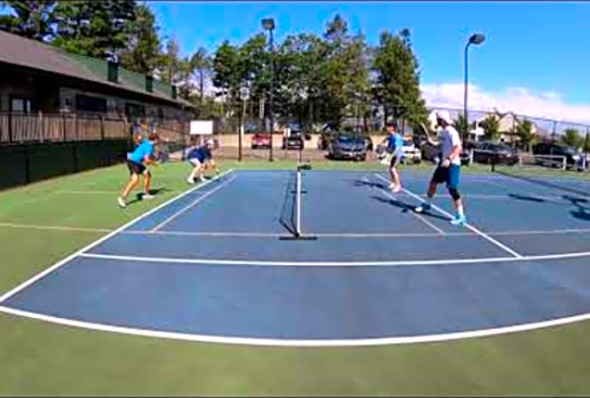 Chris and Riley taking on Andrew and Matt S. in a friendly pickleball match
