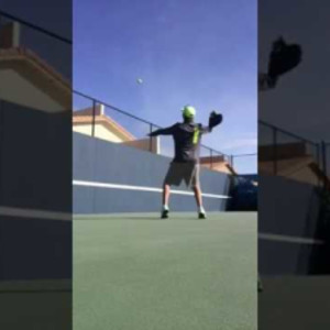 Pickleball overhead practice on the wall.