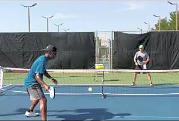 Drilling the backhand cross court dink with occasional attacks.