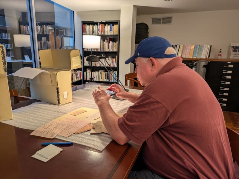 Ray examines artifacts