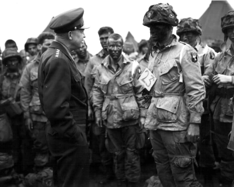 General Eisenhower chatting with airborne soldiers of the 101st Division