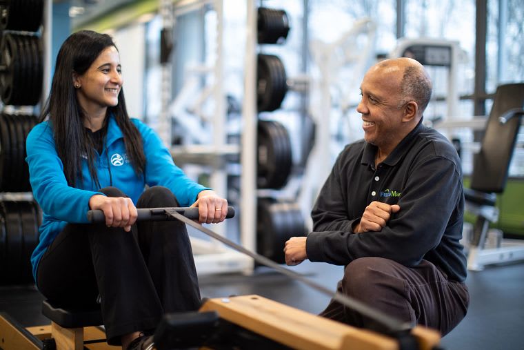 Two employees at the Freddie Mac gym.