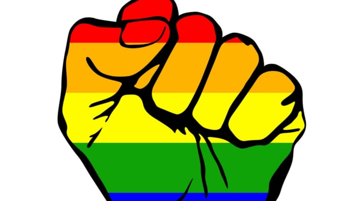“Human Shield” Bravely Blocks Violent Hate Group From Harassing Kids At Library Pride Event