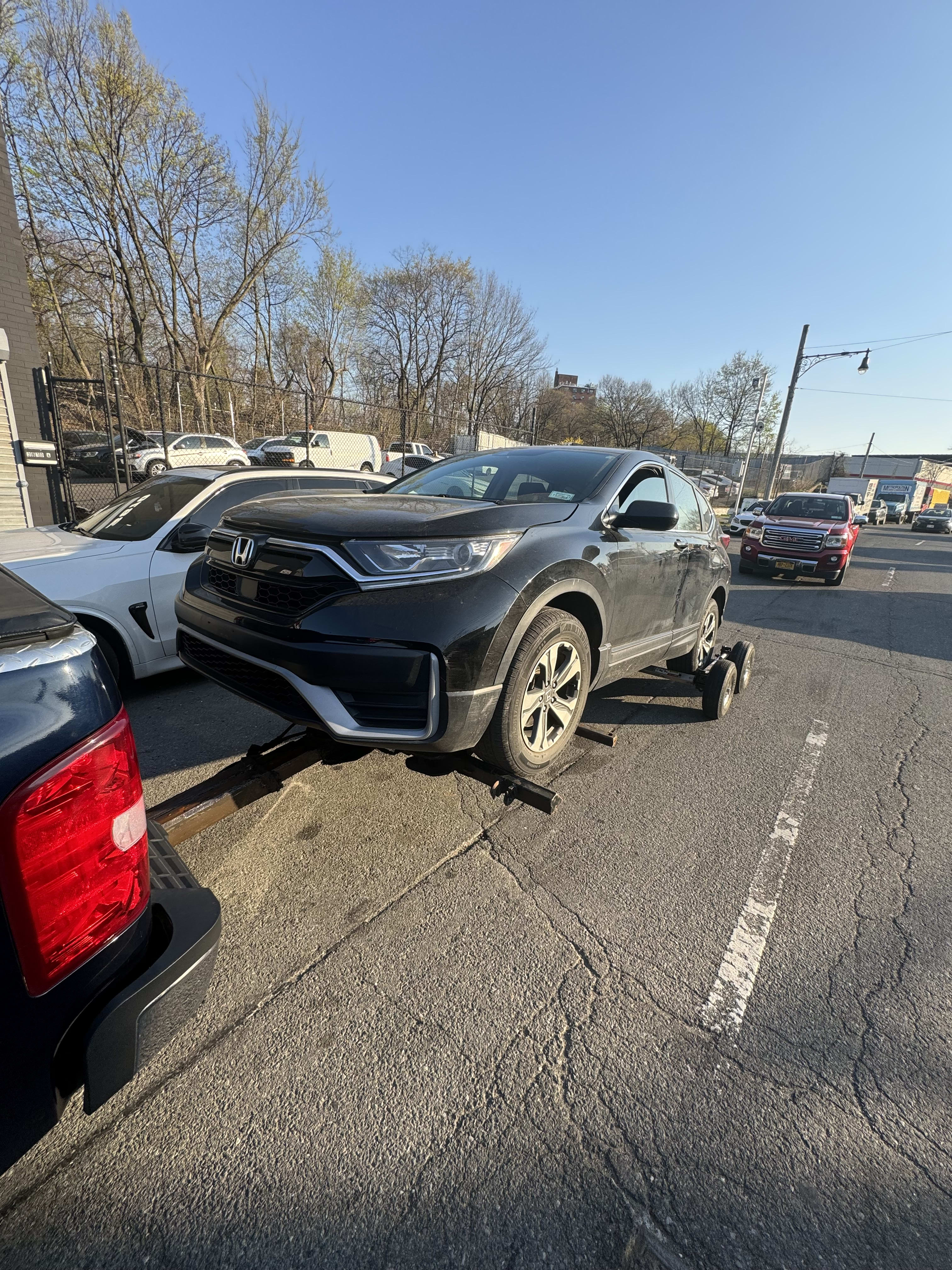 Triple III tow truck loading a vehicle