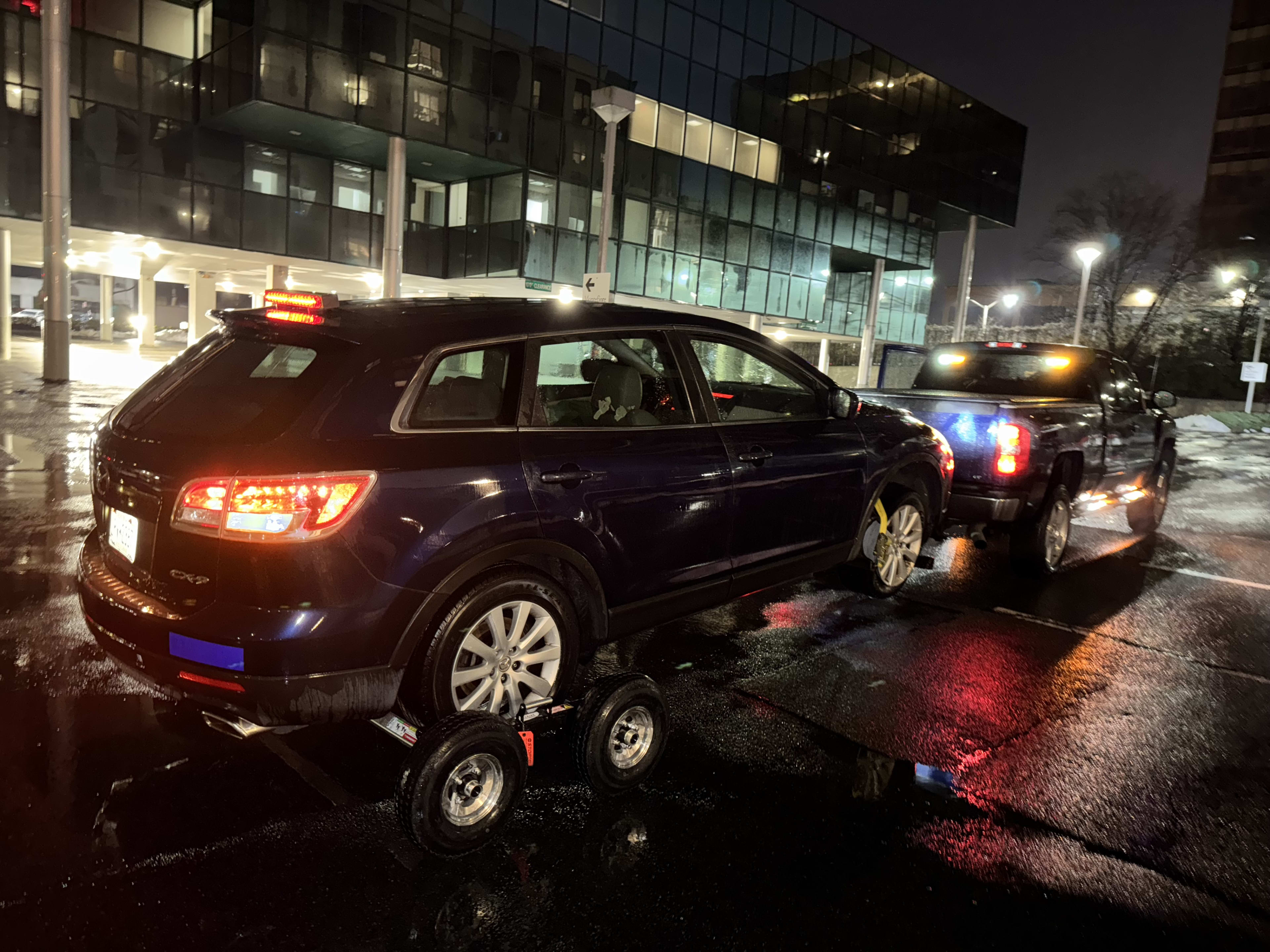 Triple III tow truck working a job in the Bronx at night