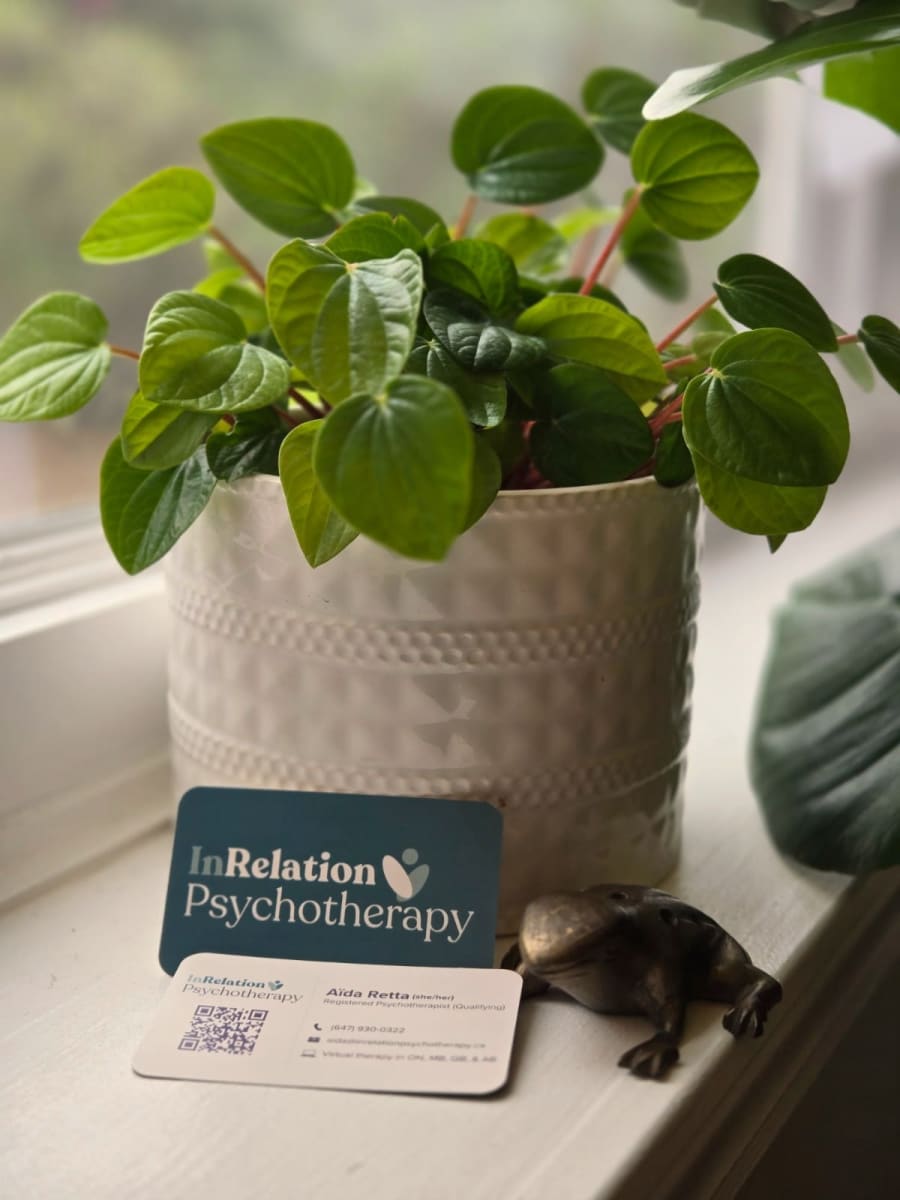 InRelation Psychotherapy card beside a potted plant on a windowsill