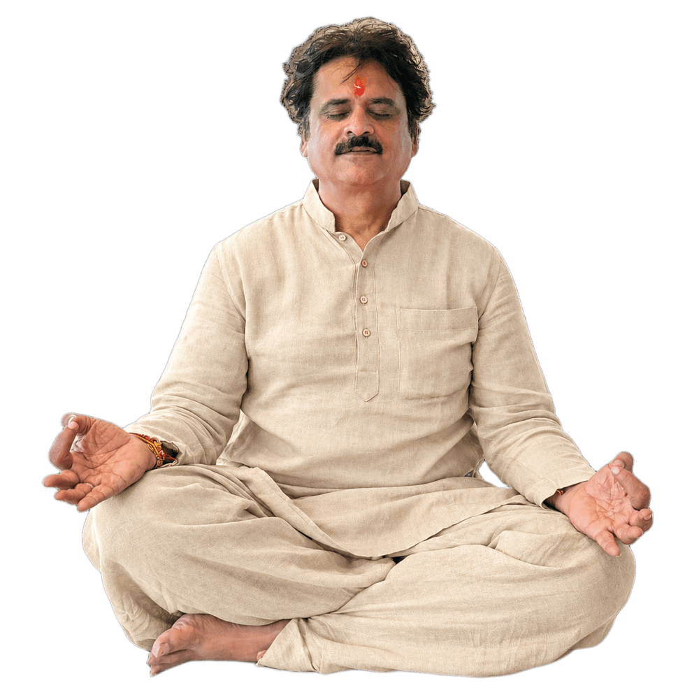 A man meditating in a traditional kurta