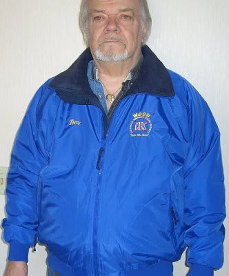 Man wearing a blue CARS jacket, embroidered with name and callsign - front view