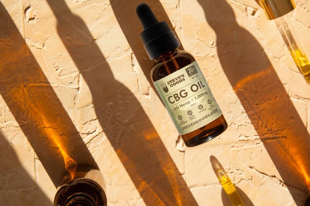 An array of wholesale CBD products sit on a wooden surface
