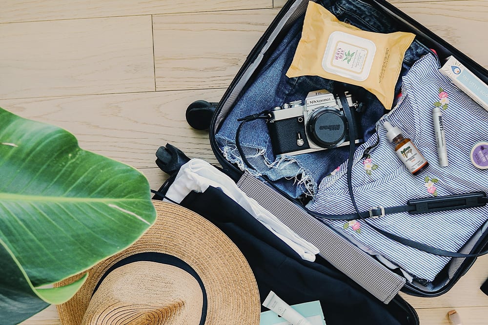 CBD oil getting packed away into a suitcase before a flight