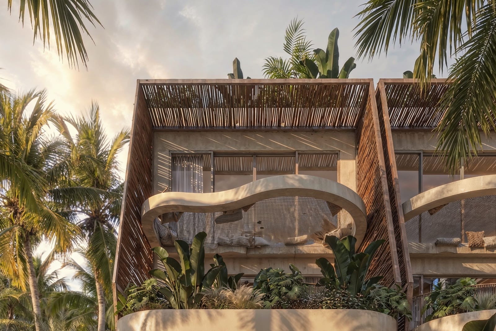 The front of a Magic Towers building: the upper floors with their terraces and woven screens