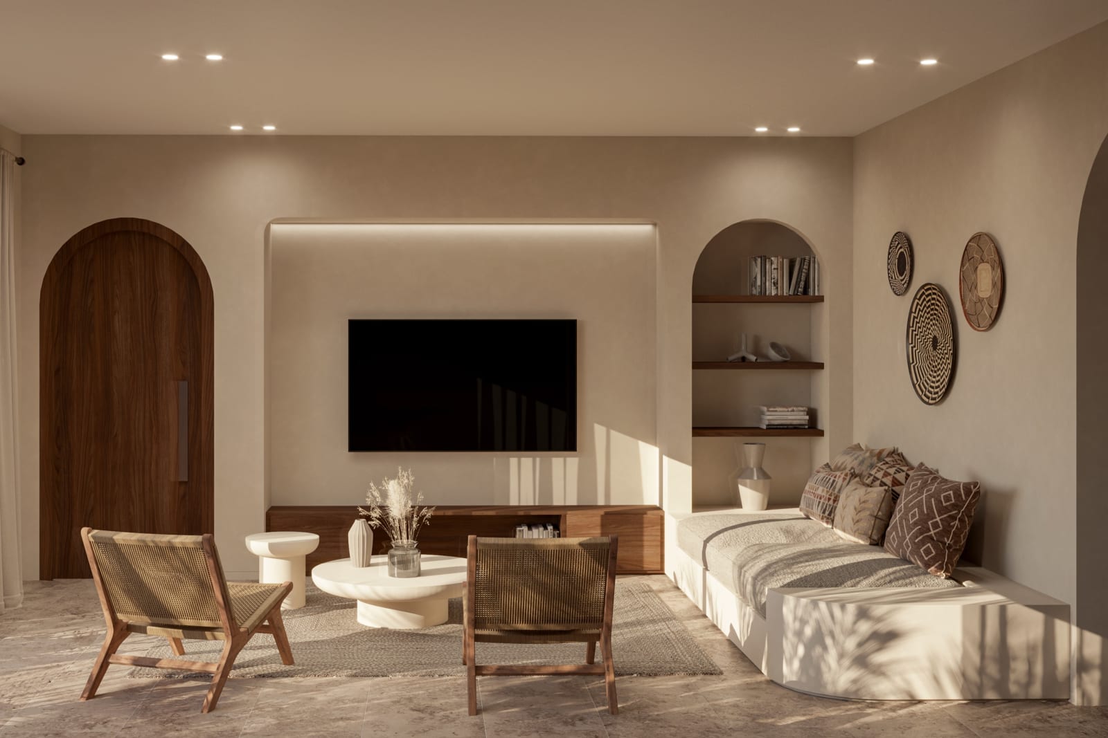 The living room of a Premium Apartment, armchairs before the television wall