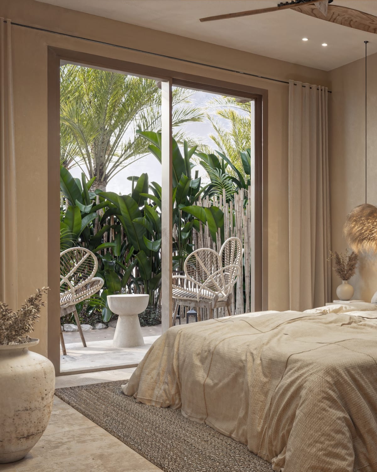 The bedroom, its sliding doors open onto the garden, Samaná Loft Villa · Render