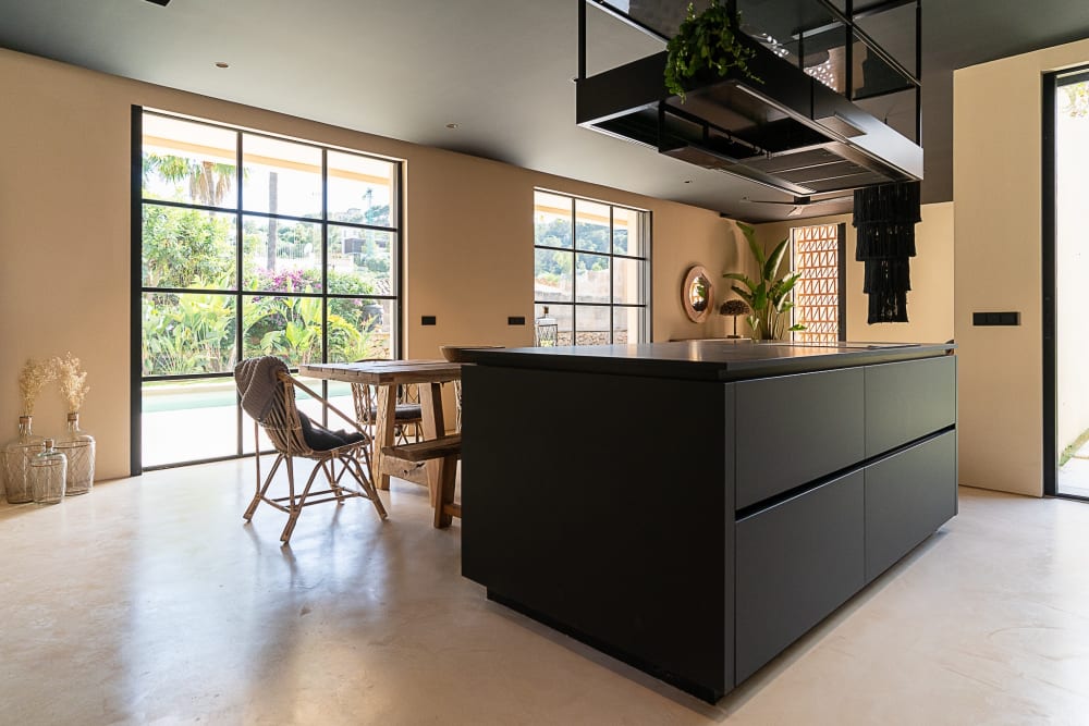 Kitchen island and dining table, with the garden beyond the glass, Falco 10