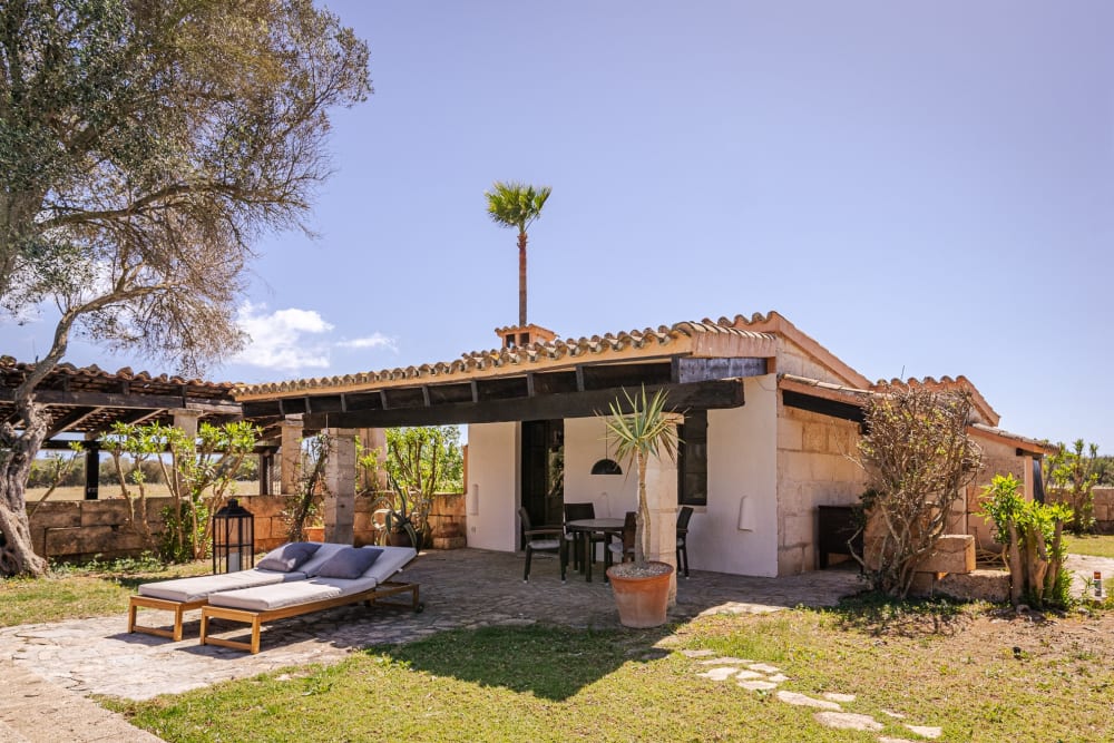The guest house and its covered terrace, across the garden, Hacienda Hermosa