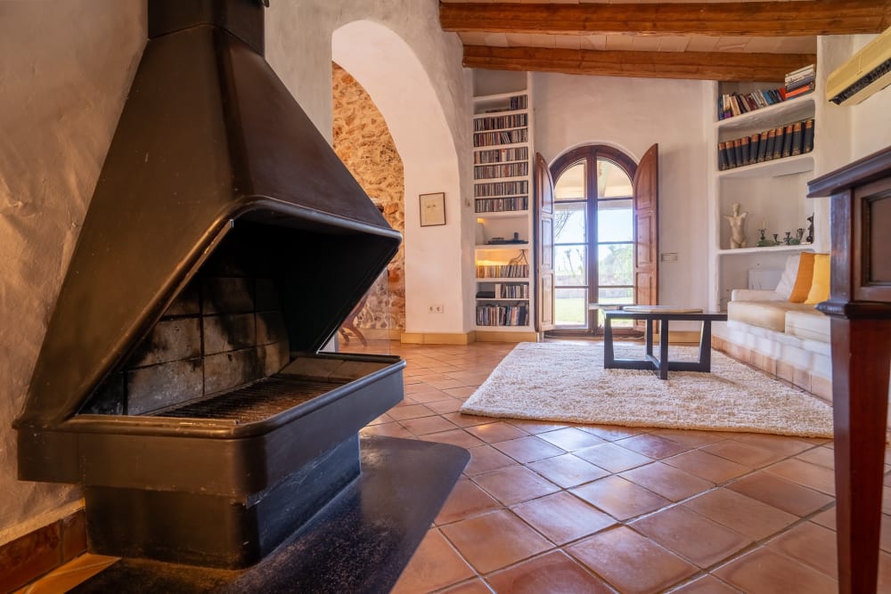 A black fireplace and bookshelves in the office, Hacienda Hermosa